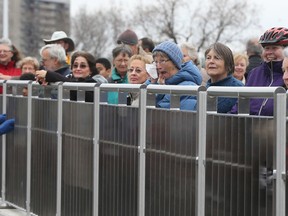 The new Adawe Crossing bridge opened on Friday Dec 4, 2015. The pedestrian and cycling bridge which goes over the Rideau River connects between Donald Street and Somerset Street Wast in Ottawa. A couple hundred people gathered to cross the bridge Friday.  Tony Caldwell/Ottawa Sun/Postmedia Network