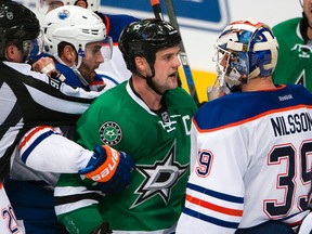 Oct 13, 2015; Dallas, TX, USA; Dallas Stars left wing Jamie Benn (14) exchanges words with Edmonton Oilers goalie Anders Nilsson (39) during the second period at the American Airlines Center. Mandatory Credit: Jerome Miron-USA TODAY Sports