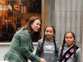 Francesa Pheasant, centre, and Autumn Peltier, both from the Wikwemikong First Nation, present a manifesto on conserving the world's resources to Asa Romson, the environment and climate minister for Sweden, during a Children's Climate Conference in Sodertalje, Sweden last week.