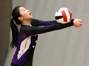 Lo-Ellen Knights S. Ng bumps the ball during senior girls volleyball action against St. Charles on Thursday.