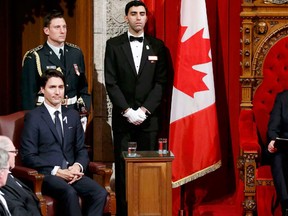 Canada's Governor General David Johnston (2nd R) delivers the Speech from the Throne as Prime Minister Justin Trudeau (L) looks on in the Senate chamber on Parliament Hill in Ottawa, Canada December 4, 2015. REUTERS/Chris Wattie