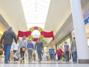 Shoppers walk through White Oaks Mall. Columnist George Clark remembers when shopping wasn?t possible on Sunday due to the federal government?s Lord?s Day Act which frowned upon doing any business or attending sporting events on Sundays. (Free Press file)