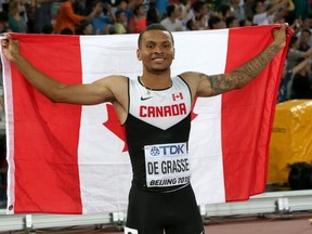 Canada’s Andre De Grasse celebrates after winning the bronze medal in the 100 metres at the World Athletics Championships in Beijing, Sunday, Aug. 23, 2015. (THE CANADIAN PRESS/AP/Lee Jin-man)