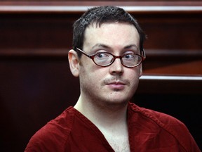 In this Aug. 24, 2015, file photo, James Holmes appears in court for the sentencing phase in his trial at Arapahoe County District Court in Centennial, Colo. Holmes has been ordered to pay about $955,000 in restitution to the victims of his 2012 movie theater shooting, money that will never likely be paid by the imprisoned mass killer. (RJ Sangosti/The Denver Post via AP, Pool, File)