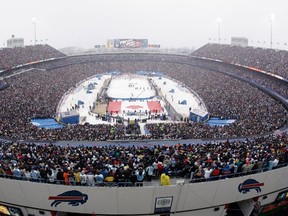 Buffalo Sabres and Pittsburgh Penguins stand for the national anthem at the start of the NHL Winter Classic at Ralph Wilson Stadium in Orchard Park, N.Y., on Jan. 1, 2008. (THE CANADIAN PRESS/AP, David Duprey)