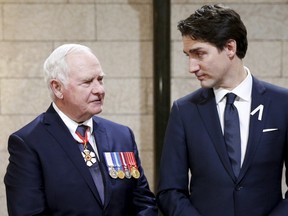 Canada's Governor General David Johnston (L) and Prime Minister Justin Trudeau speak in the Hall of Honour before the Speech from the Throne on Parliament Hill in Ottawa, Canada December 4, 2015.    REUTERS/Blair Gable