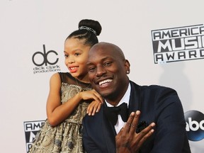 Tyrese Gibson and his daughter, Shayla Somer, arrive at the 2015 American Music Awards in Los Angeles, California November 22, 2015.  REUTERS/David McNew