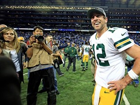 Quarterback Aaron Rodgers of the Green Bay Packers celebrates after throwing the game-winning touchdown pass with time expired to defeat the Detroit Lions 27-23 at Ford Field on December 3, 2015 in Detroit. (Andrew Weber/Getty Images/AFP)