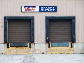 A sign hangs above the loading dock at the Touche Bakery Outlet on Neptune Crescent in London. on Friday. The kosher baking facility is being moved to Brantford.  Craig Glover/The London Free Press/Postmedia Network