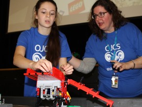 Anya Sachs talks to Karen Gordon, one of the coaches for the Rambots at the Ottawa Jewish Community School during ‘Rambots’ the first Lego league regional robotics competition on Friday. 
JULIE BAY/OTTAWA SUN