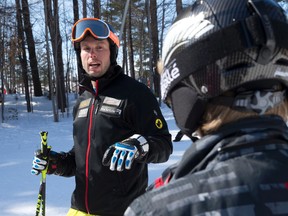 Ski cross competitor and Londoner Dave Duncan talks to a group of young skiers before they hit the slopes at Boler Mountain in London, Ontario on Sunday March 8, 2015. (Free Press file photo)