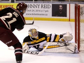 Kingston Frontenacs goalie Lucas Peressini stops Peterborough Petes Jonathan Ang on a breakaway during Ontario Hockey League action at the Rogers K-Rock Centre in Kingston on Friday. (Ian MacAlpine/The Whig-Standard)