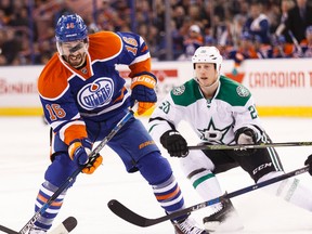 Edmonton forward Teddy Purcell (16) battles Dallas centre Cody Eakin (20) for the puck during the first period of a NHL game between the Edmonton Oilers and the Dallas Stars at Rexall Place in Edmonton, Alta. on Friday December 4, 2015. Ian Kucerak/Edmonton Sun/Postmedia Network