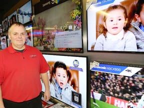 Pete Thibeault, general manager of Bianco's Supercenter in Sudbury, shows a selection of televisions available at the store. John Lappa/Sudbury Star