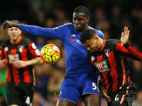 Chelsea’s Kurt Zouma, left, competes for the ball with Bournemouth’s Andrew Surman during English Premier League play at Stamford Bridge stadium in London, Saturday, Dec. 5, 2015. (AP Photo/Kirsty Wigglesworth)