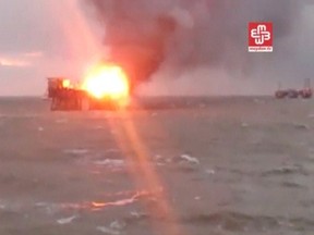 A still image from a video footage shows an oil platform on fire in the Caspian Sea, Azerbaijan, December 5, 2015. REUTERS/MEYDAN TV via Reuters