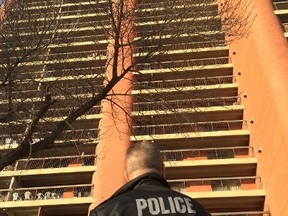 Police investigating at an apartment building at Jasper Avenue and 88 Street Saturday morning. DAVID BLOOM/EDMONTON SUN/POSTMEDIA NETWORK