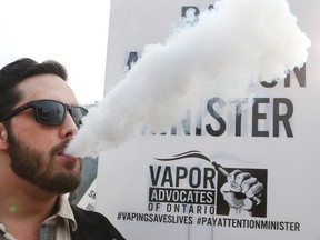 Andy Schoch, 30, at a rally supporting vaping, and the use of electronic cigarettes in front of Queen's Park Dec. 5, 2015. (Veronica Henri/Toronto Sun)