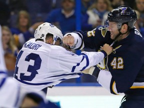 St. Louis Blues' David Backes fights with Toronto Maple Leafs' Nazem Kadri in the second period of an NHL hockey game, Saturday, Dec. 5, 2015 in St. Louis. (AP Photo/Tom Gannam)