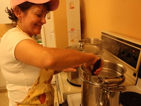 Cheryl Bennewies of north Dublin stirs the noodles for the spaghetti dinner at the Bethel Bible Church in Seaforth on December 3.(Shaun Gregory/Huron Expositor)