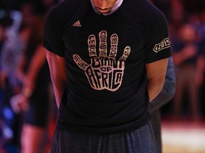 Toronto Raptors DeMar DeRozan wearing a Giant of Africa t-shirt in honour of Nelson Mandela Day before game against the Goldem St. Warriors in Toronto, Ont. on Saturday December 5, 2015. (Jack Boland/Postmedia Network)