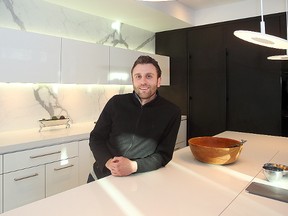 Winnipeg architect Dovide Secter stands in his kitchen in Winnipeg, Man. Thursday Dec. 3, 2015. Secter won an international award for the design of his kitchen.
(Brian Donogh/Winnipeg Sun/Postmedia Network)