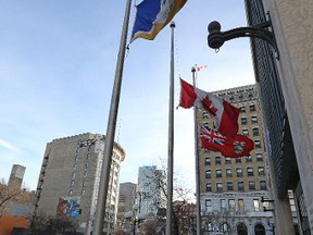 City, provincial and national flags at City Hall in Winnipeg were at half-staff on Sunday, Dec. 6, 2015, to recognize the National Day of Remembrance and Action on Violence Against Women. Parliament began observing the date in 1991, two years after the 1989 Ecole Polytechnique massacre in Montreal. (Kevin King/Winnipeg Sun/Postmedia Network)
