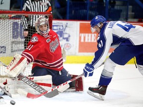 Sudbury Wolves Mikkel Aagaard tries to get his stick on the loose puck in front of Oshawa Generals goalie Logan Gauthier during OHL action in Sudbury, Ont. on Sunday December 6, 2015. Gino Donato/Sudbury Star/Postmedia Network
