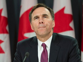 Minister of Finance Bill Morneau speaks to media as he delivers a fiscal update during a news conference, in Ottawa, on Friday, Nov. 20, 2015. The Liberals' “middle class” tax cut originally promised during the election campaign doesn’t much benefit the middle class as the biggest tax cut goes to people earning $89,000 to $200,000. THE CANADIAN PRESS/Adrian Wyld