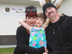 Parents Kat and Will Geczi with their daughter, Salem. Darren Makowichuk/Calgary Sun/QMI AGENCY