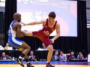 Kingston’s Cleo Ncube, left, wrestles Ilya Abelev of the Black Bears Wrestling club in a first-round match at the Edmonton-hosted Canadian Olympic Trials on the weekend. Ncube pinned Abelev, last year’s bronze medallist, and eventually finished atop the competition with a 6-0 mark.
(www.eye58photography.com)