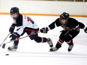 Nickel City Sharks David Lavergne and Nickel City Thunder Zacharie Guenette battle for the puck during PeeWee A Silver Stick Championship game action in Sudbury, Ont. on Sunday December 6, 2015. Gino Donato/Sudbury Star/Postmedia Network