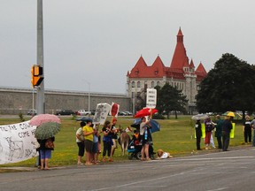 Save Our Prison Farm supporters gather on the fifth anniversary of the last cattle being removed from Frontenac Institution on Aug. 10, 2015. (Julia McKay/The Whig-Standard)