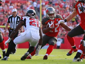 Tampa Bay Buccaneers running back Doug Martin runs with the ball against the Atlanta Falcons during the second half at Raymond James Stadium. Tampa Bay defeated Atlanta 23-19. (Kim Klement/USA TODAY Sports)