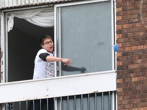 John Lappa/Sudbury Star file photo
A distraught Wendell Bondy hurls a cup at police and emergency services workers at an apartment on the Lloyd Street hill on April 23.