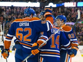 The Edmonton Oilers celebrate Jordan Eberle's (14) goal against the Buffalo Sabres during first period NHL action at Rexall Place, in Edmonton, Alta. on Sunday Dec. 6, 2015. David Bloom/Edmonton Sun/Postmedia Network