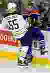 The Edmonton Oilers' Luke Gazdic (20) battles the Buffalo Sabres' Rasmus Ristolainen (55) during second period NHL action at Rexall Place, in Edmonton, Alta. on Sunday Dec. 6, 2015. David Bloom/Edmonton Sun/Postmedia Network