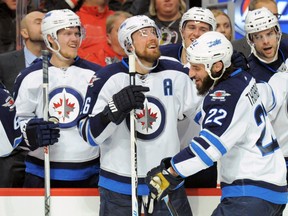 Dec 6, 2015; Chicago, IL, USA; Winnipeg Jets right wing Blake Wheeler (26) celebrates right wing Chris Thorburn's (22) goal during the second period at United Center. Mandatory Credit: Patrick Gorski-USA TODAY Sports
