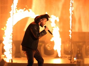 In this Sunday, Nov. 22, 2015, file photo, the Weeknd performs at the American Music Awards at the Microsoft Theater in Los Angeles. (Photo by Matt Sayles/Invision/AP, File)