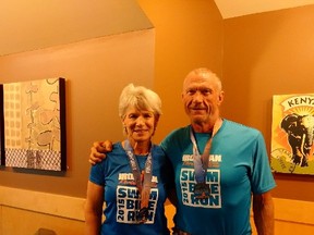 Putting in the miles, Elizabeth Model and John Wragg pose after the Ironman competition earlier this year in Florida.(Supplied)