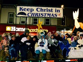 The Mitchell/Logan Knights of Columbus packed as many costumed kids and their parents onto their Nativity-Scene themed float as possible for the Mitchell Lions Santa Claus Parade, held under almost ideal (although with no snow) weather conditions last Friday, Dec. 4. GALEN SIMMONS/MITCHELL ADVOCATE