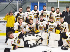 Members of the Mitchell Bantam AE's pose with their championship banner after winning the Regional Silver Stick title in St. Clements this past weekend. SUBMITTED