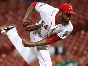 Cincinnati Reds relief pitcher Aroldis Chapman throws against the Chicago Cubs, Wednesday, Sept. 30, 2015, in Cincinnati. (AP Photo/John Minchillo)