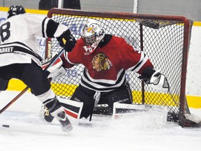 Brock Baier, goalie with the Mitchell Hawks, recorded this save on a penalty shot by Goderich Flyers’ Noah Kuno, late in the first period Sunday, Dec. 6. Baier stopped all the shots in the two periods he played, and his teammates had no trouble finding the net at the other end in a 12-0 victory. ANDY BADER/MITCHELL ADVOCATE