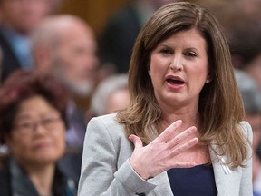 Interim leader of the Opposition Rona Ambrose comments on the government's speech from the throne on Parliament Hill in Ottawa, Monday Dec. 7, 2015. THE CANADIAN PRESS/Adrian Wyld