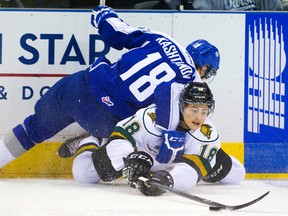 Sudbury Wolves newcomer  Ryan Valentini gets tangled up with former Wolves forward Ivan Kashtanov during OHL action in London, Ont., on Nov. 2, 2014.
