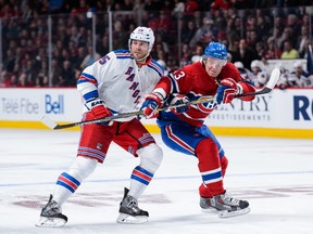 Viktor Stalberg of the New York Rangers blocks Alexander Semin of the Montreal Canadiens at the Bell Centre on October 15, 2015 in Montreal. (Minas Panagiotakis/Getty Images/AFP)