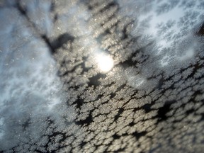 Frost is seen on a window from inside a car. (Ian Kucerak/Edmonton Sun file)