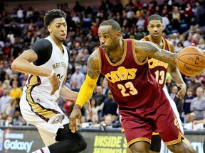 Cleveland Cavaliers forward LeBron James (23) drives past New Orleans Pelicans forward Anthony Davis (23) at the Smoothie King Center. (Derick E. Hingle/USA TODAY Sports)