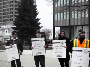 City workers picket outside of Sarnia city hall ahead of Monday's council meeting. While city council held off Monday on a decision around a proposal to trim early retirement benefits, council is expected to have that discussion in the new year. (Barbara Simpson/Sarnia Observer/Postmedia Network)